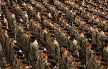 American soldiers from the 172nd Stryker Brigade Combat Team standing at attention. From http://www.defenselink.mil/PhotoEssays/PhotoEssay.aspx?ID=166&Page=4&Count=12