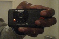 A picture of the Sony Ericsson w810i, as seen in the mirror.